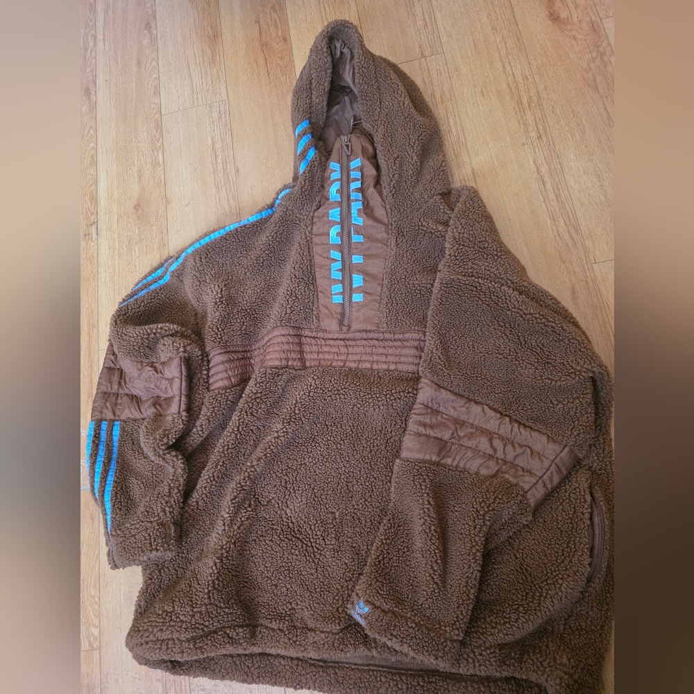 Authentic Adidas X Ivy Park Brown Fleece Hoodie with Blue Stripes.